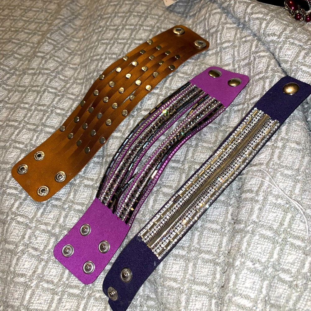 3 adjustable leather-ish wrap bracelet.